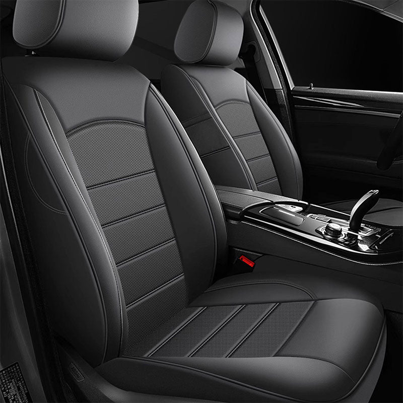 Black PU leather front seat covers fitted to the driver and passenger seats