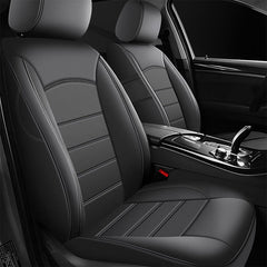 Black PU leather front seat covers fitted to the driver and passenger seats