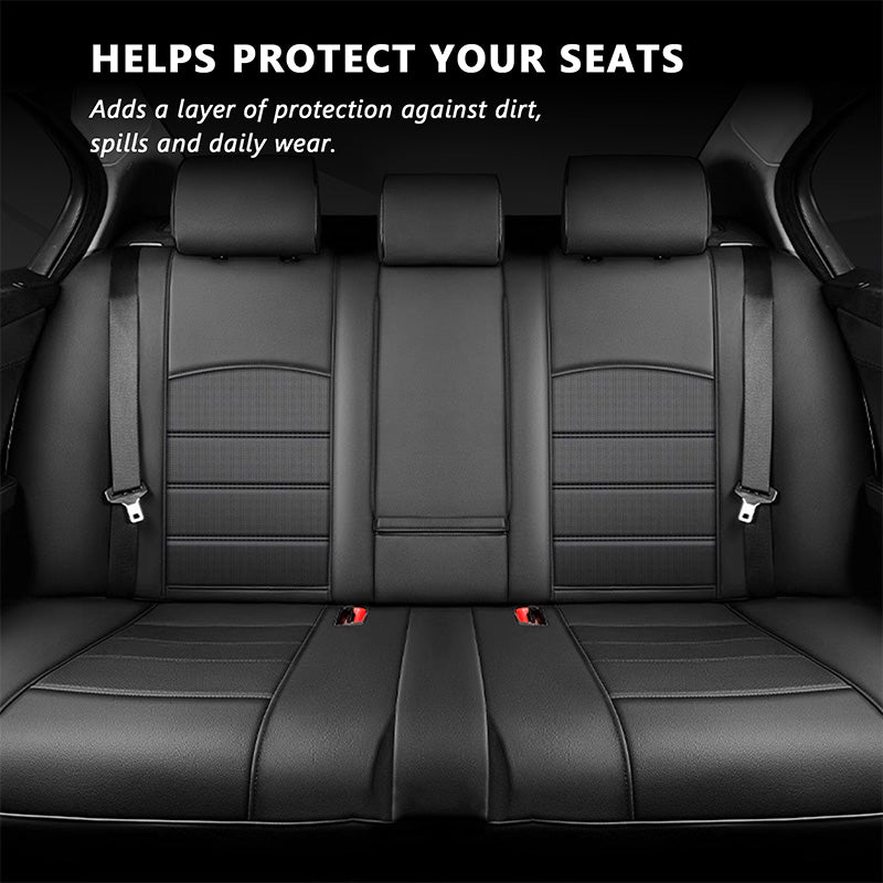 Black PU leather rear seat covers fitted across the rear bench