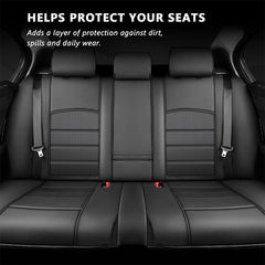 Black PU leather rear seat covers fitted across the rear bench